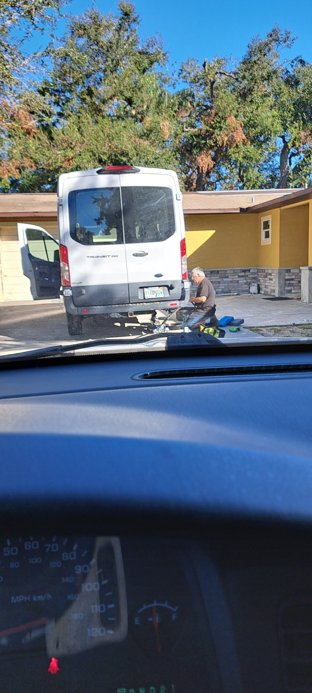 A van is parked in front of a house